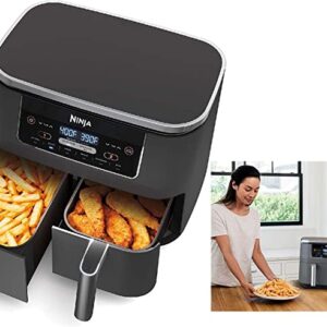 Ninja air fryer with baskets open holding fries and potato wedges next to woman holding plate of fries