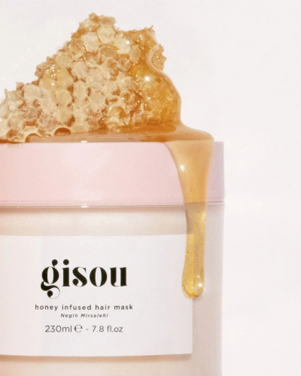 gisou infused hair mask with honey comb and honey dripping down jar